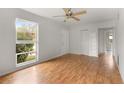 Spacious living room featuring hardwood floors and a ceiling fan at 2473 Barbarossa, Deltona, FL 32738
