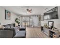 Spacious living room with L-shaped sofa and large TV at 1211 Josephine St, Lakeland, FL 33815