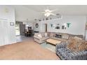 Spacious living room featuring a sectional sofa and large TV at 227 Ridgedale Dr, Lakeland, FL 33809