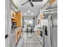 Modern kitchen with stainless steel appliances, wood cabinets, and breakfast nook at 4617 S Devon Ave, Lakeland, FL 33813