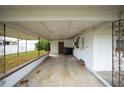 Covered carport area with access to the house at 1568 S Lake Shipp Dr, Winter Haven, FL 33880