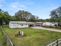 House with large backyard and white fence at 210 Wilder Rd, Lakeland, FL 33809