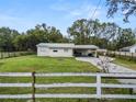 Ranch-style home with carport and fenced yard at 210 Wilder Rd, Lakeland, FL 33809