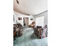 Bright living room with ample seating and a view to the dining area at 5805 Danterbury Ct, Lakeland, FL 33810