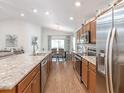 Spacious kitchen with stainless steel appliances and granite countertops at 721 Bayside Blvd, Winter Haven, FL 33881