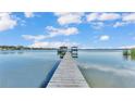 Wooden dock extending to lake with two gazebos at 809 Fairlane Dr, Lakeland, FL 33809