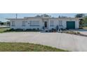 Charming single story home with a large driveway and well-manicured landscaping at 2200 S Peninsula Dr, Daytona Beach, FL 32118
