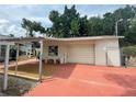 Detached garage with covered parking and additional storage at 607 N Dixie Fwy, New Smyrna Beach, FL 32168