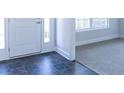 Home entryway with tile and carpet flooring at 243 Lagoon Mist Ct, Oak Hill, FL 32759