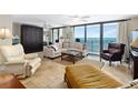 Living Room with ocean view and comfortable seating at 4139 S. Atlantic Ave # B504, New Smyrna Beach, FL 32169