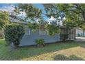Gray house with well-maintained lawn and landscaping at 1355 Powers Ave, Daytona Beach, FL 32117