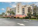 Condo building exterior, featuring light beige and blue accents at 5300 S Atlantic Ave # 8502, New Smyrna Beach, FL 32169