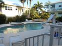 Kidney shaped pool with a spa and a slide at 610 S Atlantic Ave, New Smyrna Beach, FL 32169