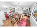 Bright dining room features a wood table with matching chairs and chandelier at 1213 Jeffery Dr, Port Orange, FL 32129