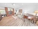 Spacious living room with a brick fireplace and comfy seating at 1213 Jeffery Dr, Port Orange, FL 32129