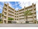 Condo building with palm trees and ocean view at 4501 S Atlantic Ave # 1210, New Smyrna Beach, FL 32169