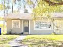 Small house with a walkway and green lawn at 226 Wildwood Ave, Edgewater, FL 32132