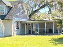 House with a screened porch and large backyard at 226 Wildwood Ave, Edgewater, FL 32132