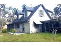House with a gabled roof and screened porch at 226 Wildwood Ave, Edgewater, FL 32132