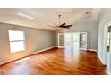 Bright living room featuring hardwood floors and French doors at 806 Pine Shores Cir, New Smyrna Beach, FL 32168