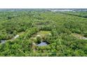 Aerial view of property showing home and surrounding land at 1795 Hideaway Ln, Edgewater, FL 32141