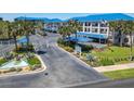 Condo community entrance with gated access and landscaping at 2700 N Peninsula Ave # 536, New Smyrna Beach, FL 32169