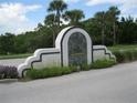 Community entrance sign with landscaping at 464 Bouchelle Dr # 104, New Smyrna Beach, FL 32169