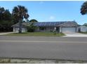 House with solar panels and a two-car garage at 806 South St, New Smyrna Beach, Fl 32168, FL 32168