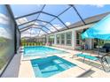 Relaxing pool and spa with covered patio at 552 Mosaic Blvd, Daytona Beach, FL 32124