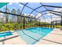 Resort-style pool and spa with screened enclosure at 552 Mosaic Blvd, Daytona Beach, FL 32124