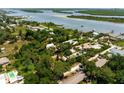 Aerial view showcasing home's waterfront location and neighborhood at 1006 S Riverside Dr, Edgewater, FL 32132