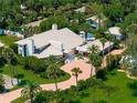 An aerial view of a house with a large yard and pool at 1006 S Riverside Dr, Edgewater, FL 32132