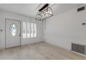 Bright entryway with light wood floors and a chandelier at 801 E 24Th Ave, New Smyrna Beach, FL 32169