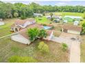 Two story home with a pool and detached garage at 299 W Hickory Ave, Oak Hill, FL 32759