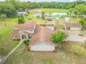 Two story home with a pool and detached garage at 299 W Hickory Ave, Oak Hill, FL 32759