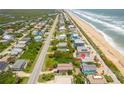 Oceanfront lot with neighboring houses and beach access at 6368 S Atlantic Ave, New Smyrna Beach, FL 32169
