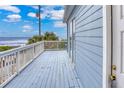 Ocean view deck with white railings at 6368 S Atlantic Ave, New Smyrna Beach, FL 32169