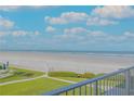 Beautiful ocean view from condo balcony with lush landscaping at 1111 Hill St # U3, New Smyrna Beach, FL 32169