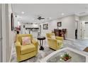 Bright and airy living room with comfortable seating and a view of the kitchen at 407 Douglas St, New Smyrna Beach, FL 32168