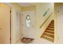 Bright entryway with stairs, door, and closet at 2051 Cornell Pl, Port Orange, FL 32128