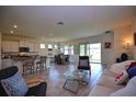 Open concept living space with kitchen and dining area at 1726 Red Rock Rd, New Smyrna Beach, FL 32168