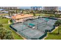 Well-maintained tennis courts for residents' enjoyment at 4650 Links Village Dr # D-501, Ponce Inlet, FL 32127