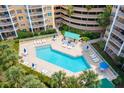 Resort-style pool with ample lounge chairs for relaxation at 4650 Links Village Dr # D-501, Ponce Inlet, FL 32127