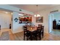 Bright dining area with seating for six and a view into the kitchen at 2801 S Ridgewood Ave # 416, South Daytona, FL 32119