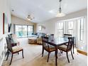 Open living room showcasing comfortable seating and a dining area at 406 Bouchelle Dr # 206, New Smyrna Beach, FL 32169