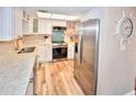 Modern kitchen with stainless steel appliances and light-colored cabinets at 4175 S Atlantic Ave # 4120, New Smyrna Beach, FL 32169