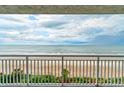 Stunning balcony view of the ocean and sandy beach at 5301 S Atlantic Ave # 52, New Smyrna Beach, FL 32169
