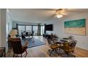 Bright dining area with ocean view and glass table for four at 5301 S Atlantic Ave # 52, New Smyrna Beach, FL 32169