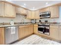 Bright kitchen with granite countertops and stainless steel appliances at 2100 N Peninsula Ave # 1150, New Smyrna Beach, FL 32169