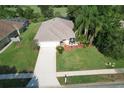 Aerial view of house, driveway, and surrounding landscape at 2624 Turnbull Estates Dr, New Smyrna Beach, FL 32168
